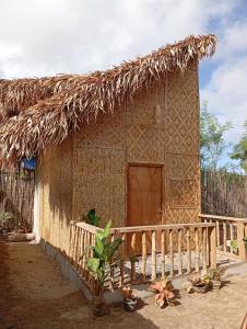 a small hut with a thatched roof at El Hermosa Beach Resort in El Nido