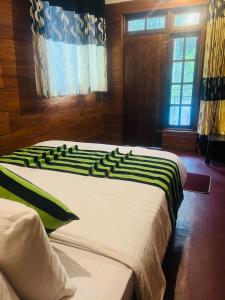 Postel nebo postele na pokoji v ubytování MUM Jungle Inn