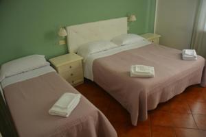 Posteľ alebo postele v izbe v ubytovaní Hotel Cordova