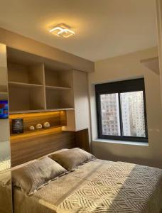 Ένα ή περισσότερα κρεβάτια σε δωμάτιο στο Apartamento 2 quartos aconchegante em frente ao Allianz Parque +41 φωτογραφίες