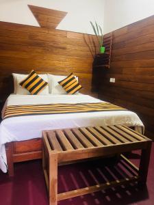 Postel nebo postele na pokoji v ubytování MUM Jungle Inn