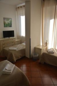 Posteľ alebo postele v izbe v ubytovaní Hotel Cordova
