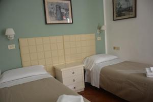 Posteľ alebo postele v izbe v ubytovaní Hotel Cordova
