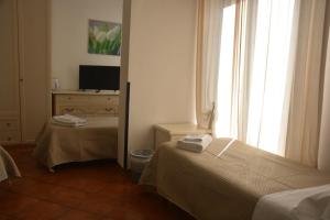 Posteľ alebo postele v izbe v ubytovaní Hotel Cordova