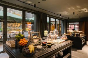 a buffet line with fruits and vegetables on a table at BoHo Hotel Budapest - Small Luxury Hotels in Budapest