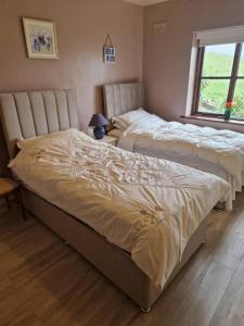 Voodi või voodid majutusasutuse Drummonds House toas