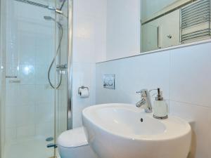 a bathroom with a sink and a toilet and a shower at Studio Harrachov by Interhome in Harrachov