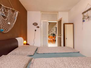 a bedroom with two beds in a room at Apartment Gagarin 2 by Interhome in Balatonkeresztúr +13 photos