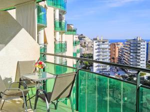 a balcony with a table and chairs on a building at Apartment Vila Park by Interhome in Cala de Finestrat