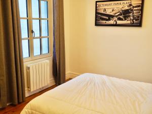 Ένα ή περισσότερα κρεβάτια σε δωμάτιο στο Villa Jouvence