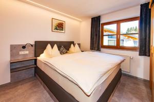 Postel nebo postele na pokoji v ubytování Ferienhaus Zentral