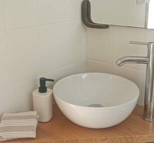 a bathroom with a white sink on a counter at Maison de charme 2 terrasses, en ville, mer, port. in Águilas +25 photos