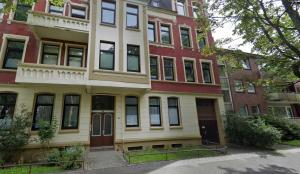 an apartment building with a red brick at oldeooge-apartment in Wilhelmshaven