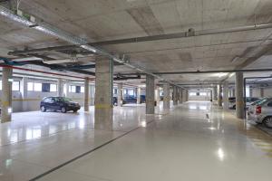 an empty parking garage with cars parked in it at Eurostars Heroismo in Porto