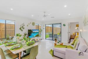 a living room with a table and a couch at Cozy&Luminous 4-bedroom house in Ripley