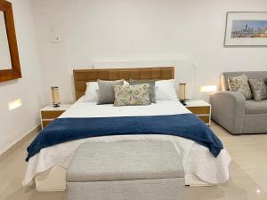 Ένα ή περισσότερα κρεβάτια σε δωμάτιο στο Hermoso apto estudio en la ciudad amurallada!