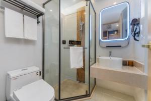 a bathroom with a toilet and a sink at Shanghai Manhua Hotel-Provides free shuttle service to Disneyland in Shanghai