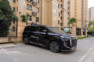 a black limo parked on the side of a street at Shanghai Manhua Hotel-Provides free shuttle service to Disneyland in Shanghai