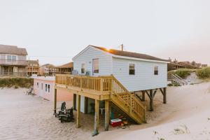 a house on a wooden deck on a beach at NH337A Coastal Dunes 1 in Nags Head