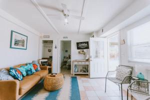 a living room with a couch and a table at NH337D Coastal Dunes 4 in Nags Head