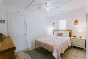 a bedroom with a bed and a ceiling fan at NH337D Coastal Dunes 4 in Nags Head