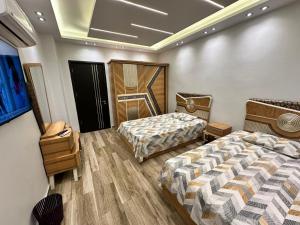 Postel nebo postele na pokoji v ubytování Grand Oasis Rooms