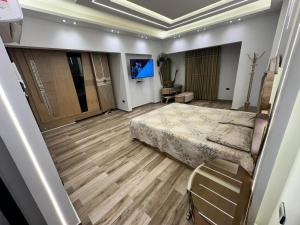 Postel nebo postele na pokoji v ubytování Grand Oasis Rooms