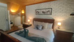 Ένα ή περισσότερα κρεβάτια σε δωμάτιο στο Tranquility Guest House +34 φωτογραφίες