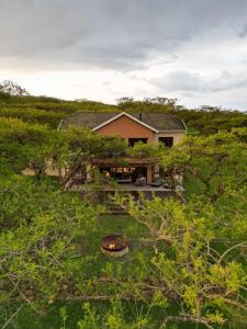 a house in the middle of a field at Cwebile Guesthouse in Winterton