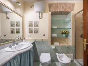 a bathroom with a sink and a toilet at Estay - Charm in Villanova in Cagliari