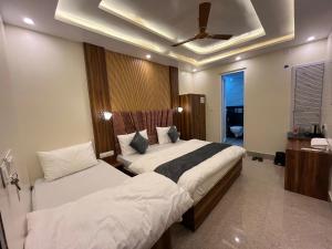 Voodi või voodid majutusasutuse Hotel Grand Safari toas