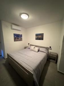 Ένα ή περισσότερα κρεβάτια σε δωμάτιο στο Patanè House's