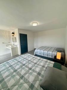 a hotel room with two beds and a sink at Valle de Cerocahui Hotel in Cerocahui +34 photos