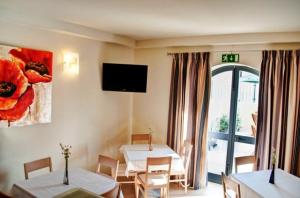 TV a/nebo společenská místnost v ubytování Hotel Kappara