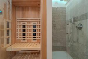 a bathroom with a shower and a walk in shower at La Contrada del Relax in Roncola +20 photos