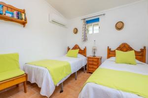 Postel nebo postele na pokoji v ubytování Finca Can Calisto