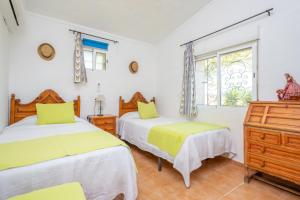Postel nebo postele na pokoji v ubytování Finca Can Calisto