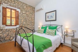 Postel nebo postele na pokoji v ubytování Finca Can Calisto