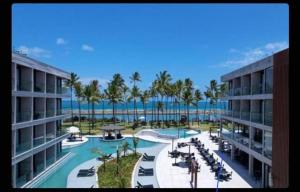 Blick auf ein Resort mit Pool und Meer in der Unterkunft GAV Resorts Porto de Galinhas in Porto De Galinhas