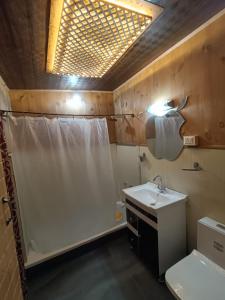 a bathroom with a sink and a shower and a toilet at Houseboat New Shamus Maqbool in Srinagar