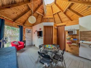 a kitchen and living room with a table and chairs at SAGRADAS de LA PALOMA in La Paloma