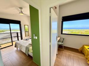 Letto o letti in una camera di Vacoa - Villa Salba. Panoramic view.