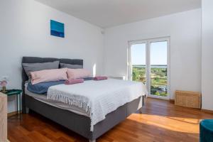 Posteľ alebo postele v izbe v ubytovaní Villa Brionika mit Pool