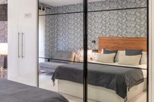 Łóżko lub łóżka w pokoju w obiekcie Luxury Apartment Alcazaba by Nagoa Homes