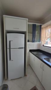 Kuchyň nebo kuchyňský kout v ubytování Apartamento no Coração de Bc, pertinho da Praia