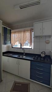 Kuchyň nebo kuchyňský kout v ubytování Apartamento no Coração de Bc, pertinho da Praia