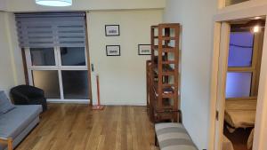 a living room with a ladder and a couch at VRS - PORTO BEACH FLAT in Porto