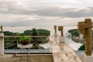a view of the water from the balcony of a house at 8 Plus Beach Resort in Panglao Island +72 photos