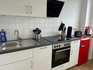 Η κουζίνα ή μικρή κουζίνα στο E&M Living in Bad Neuenahr +3 φωτογραφίες