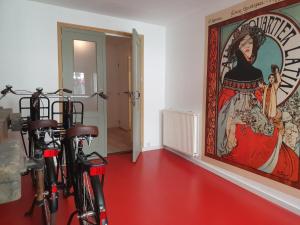a hallway with two bikes parked in front of a painting at 'Africa' - Comfortabel appartement op begane grond in Middelburg